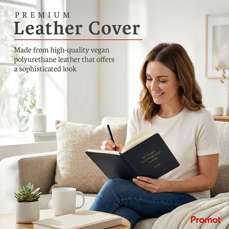 Woman writing in a black personalized leather journal with a custom gold embossed cover while relaxing on a sofa at home.