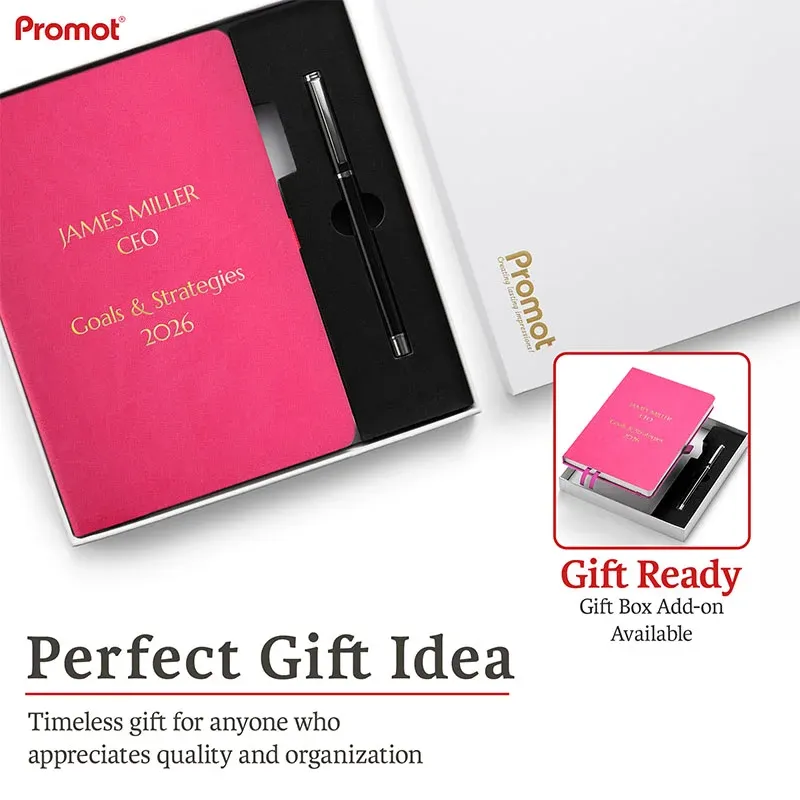 Pink notebook with gold engraving in a gift box beside a pen, a personalized leather journal ready for gift giving.