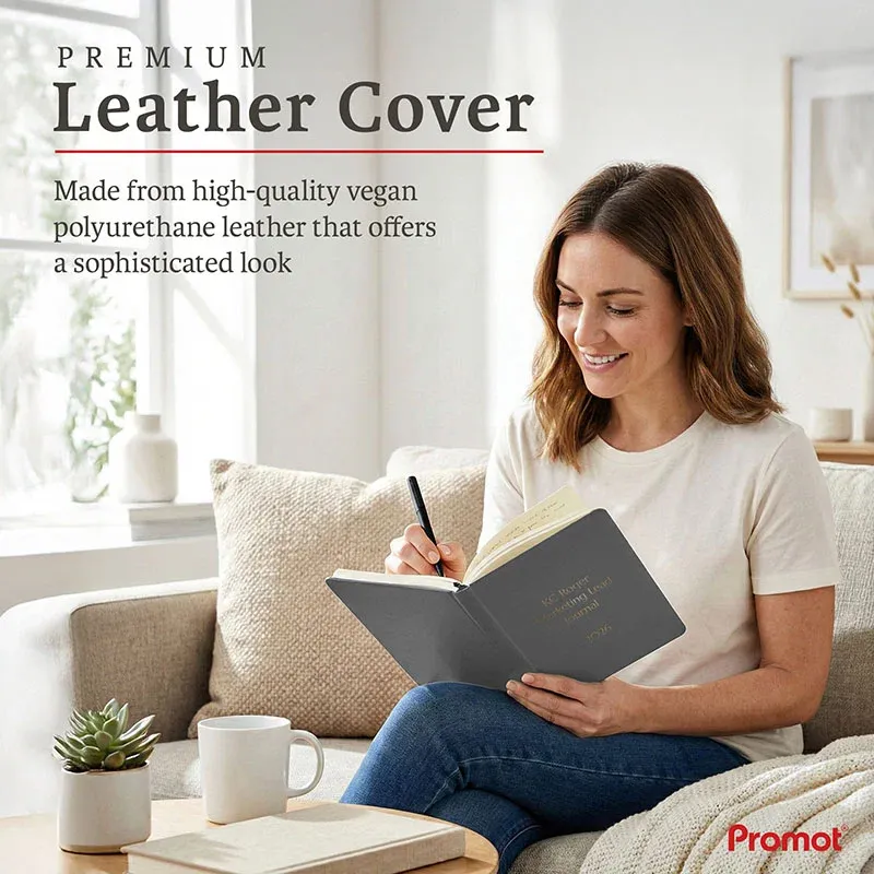 Woman writing in a gray notebook on a sofa, a personalized leather journal with a premium vegan leather cover.