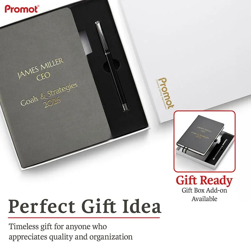 Gift box with a gray engraved notebook and pen, a personalized leather journal presented as a ready-to-gift set.