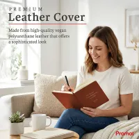Woman writing in a brown personalized leather journal while relaxing on a sofa, featuring a custom gold embossed cover.