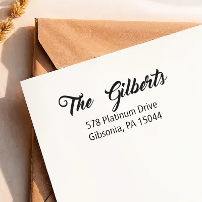 Elegant Address Stamp imprint with a custom family name and mailing address on white cardstock